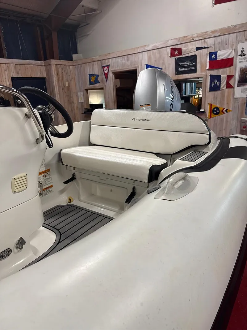 Slide: The Image of 2018 Walker Bay Generation 340 boat interior with seating and steering wheel. - 3