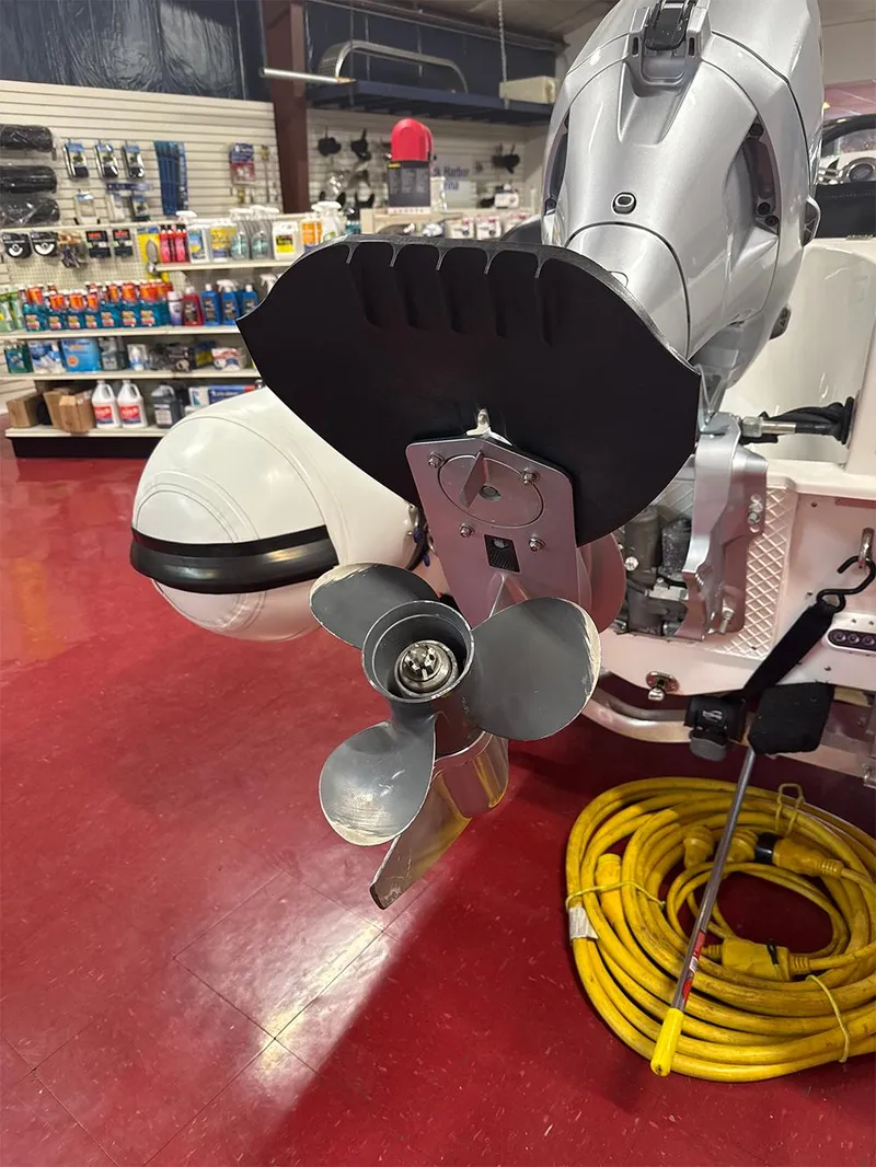 Slide: The Image of 2018 Walker Bay Generation 340 boat motor and propeller in a store display. - 5