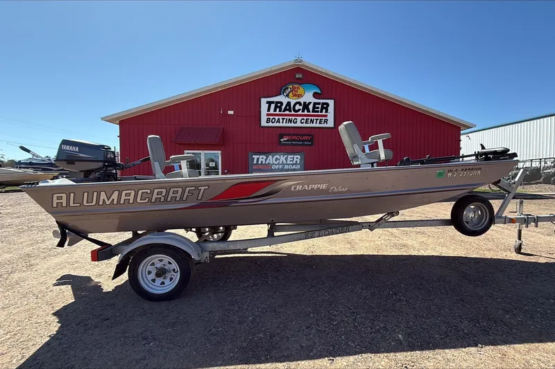 Slide: The Image of 2008 Alumacraft Crappie Deluxe boat on trailer at Tracker Boating Center. - 0