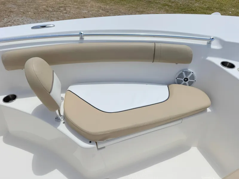 Slide: The Image of 2017 Key West 244 Center Console boat seating with beige cushions and cup holders. - 10