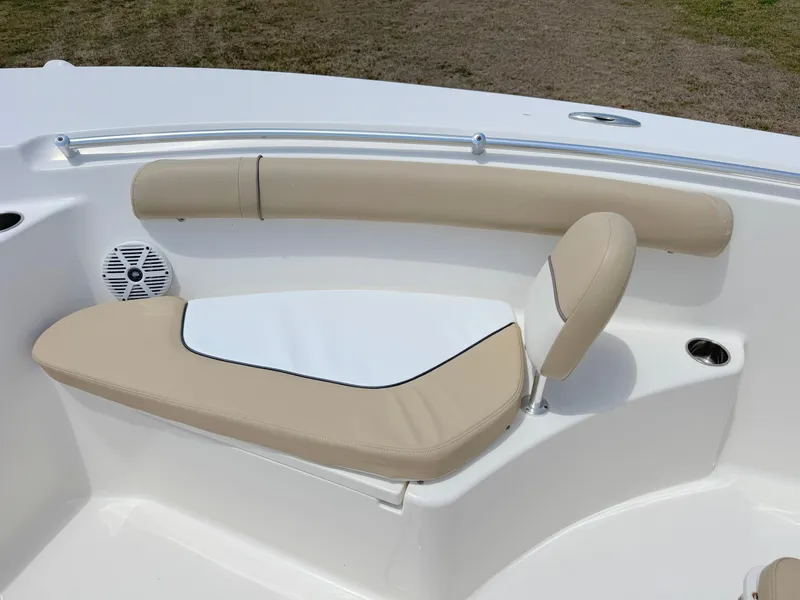 Slide: The Image of 2017 Key West 244 Center Console boat seating with beige cushions and speaker. - 11