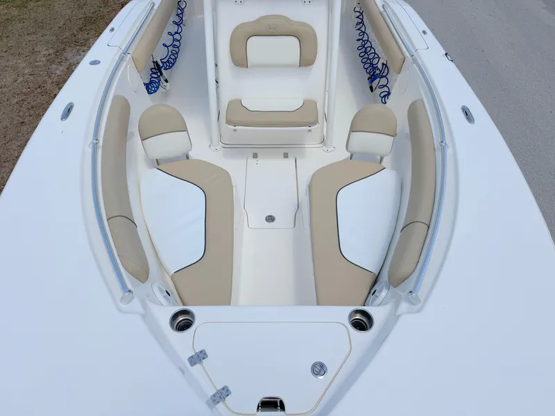 Slide: The Image of 2017 Key West 244 Center Console boat interior with beige seating and white deck. - 13
