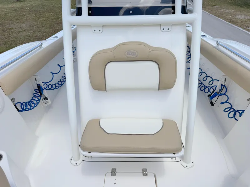 Slide: The Image of 2017 Key West 244 Center Console boat seat with beige and white cushions. - 14