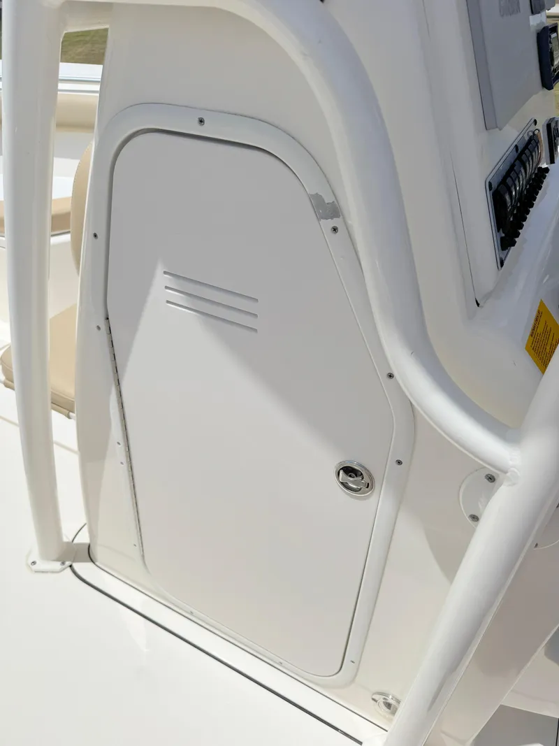 Slide: The Image of 2017 Key West 244 Center Console boat, white storage compartment detail. - 17