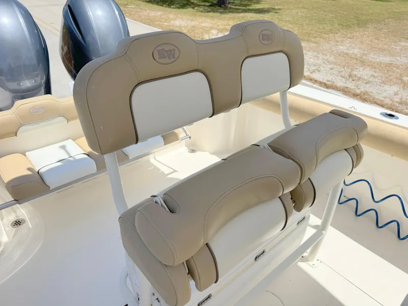 Slide: The Image of 2017 Key West 244 Center Console boat with beige and white cushioned seating. - 20