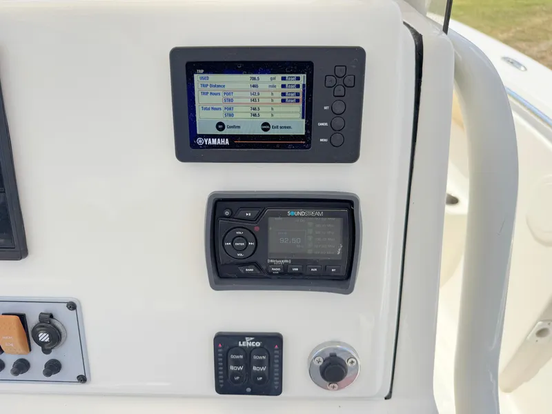 Slide: The Image of Control panel of 2017 Key West 244 Center Console boat with Yamaha display and audio system. - 24