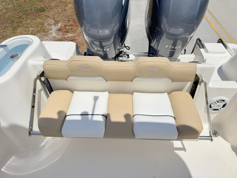 Slide: The Image of 2017 Key West 244 Center Console boat with dual engines and cushioned seating. - 26