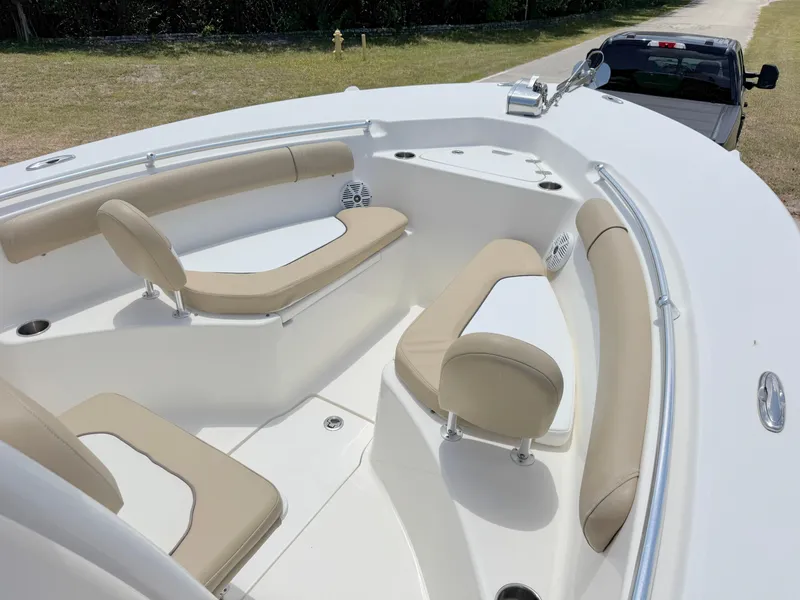 Slide: The Image of 2017 Key West 244 Center Console boat with beige seating and sleek design. - 8