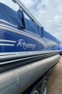 Slide: The Image of 2013 Sun Tracker PARTY BARGE 22 Regency Edition pontoon boat with blue exterior. - 5