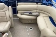 Slide: The Image of 2013 Sun Tracker PARTY BARGE 22 Regency Edition with beige seating and blue canopy. - 6