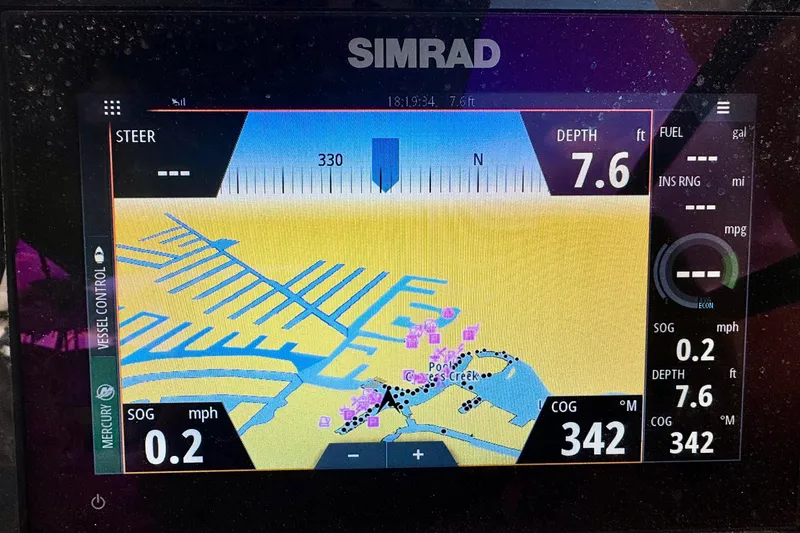 Slide: The Image of Simrad navigation display on 2021 Sea Ray SDX 270, showing depth and course. - 15