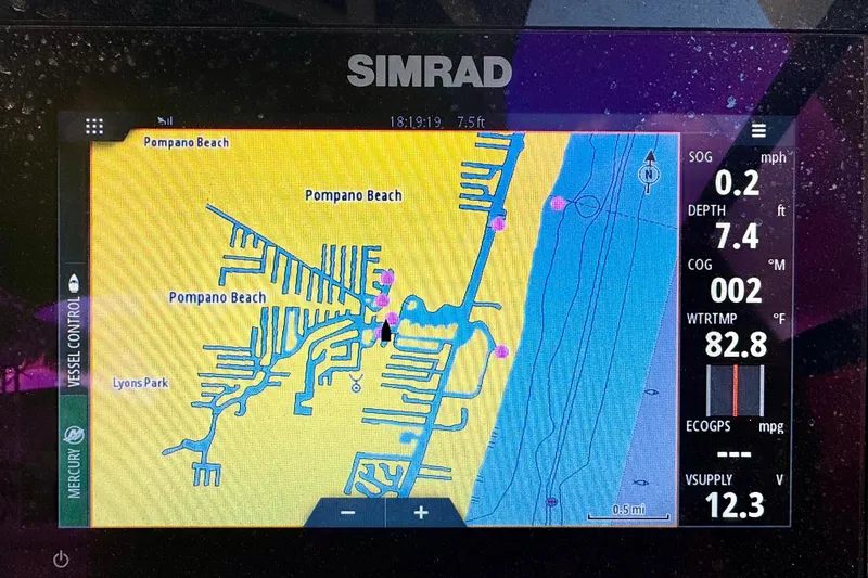 Slide: The Image of Simrad navigation display showing Pompano Beach map on a 2021 Sea Ray SDX 270. - 19
