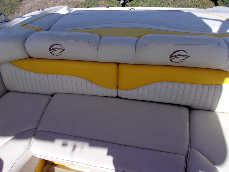 Slide: The Image of Crownline 23SS 2007 boat interior with yellow and white cushioned seating. - 11
