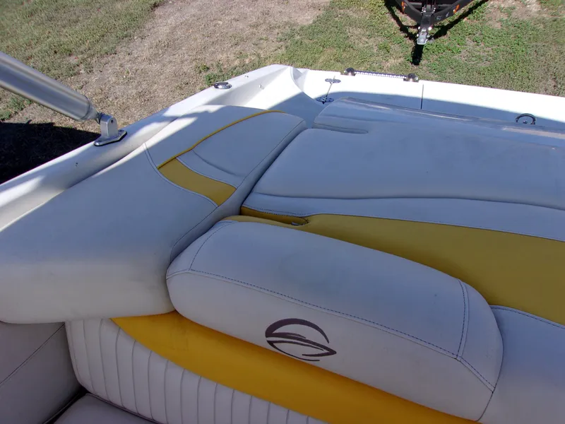 Slide: The Image of 2007 Crownline 23SS boat interior with yellow and white seating. - 12