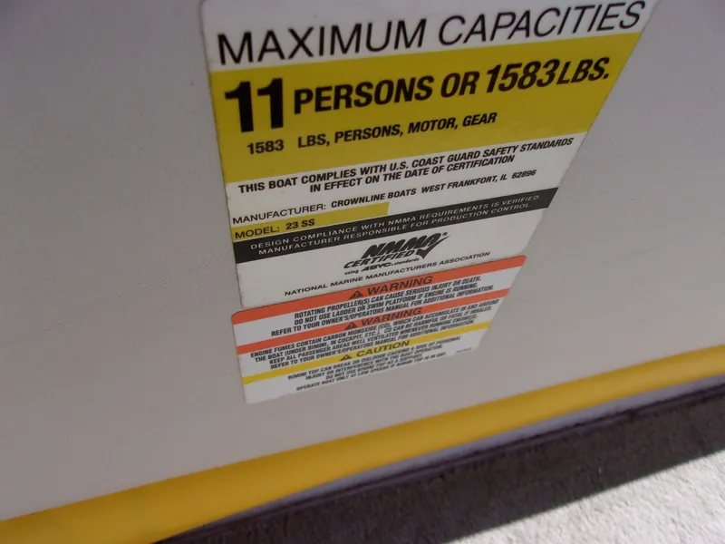 Slide: The Image of 2007 Crownline 23SS capacity label, maximum 11 persons or 1583 lbs, safety compliance details. - 17