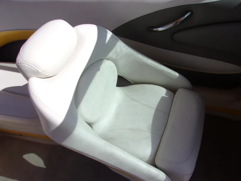 Slide: The Image of White leather seat in a 2007 Crownline 23SS boat interior. - 8