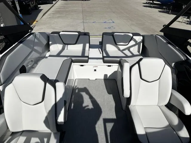 Slide: The Image of 2025 Yamaha Boats AR250 interior with white seating and modern design. - 13