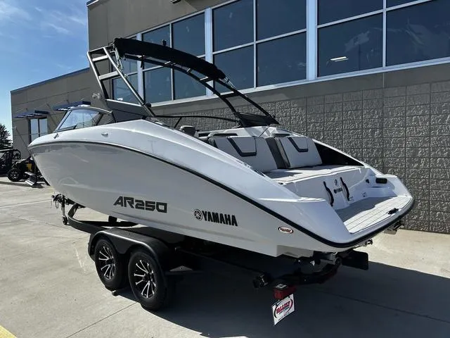 Slide: The Image of 2025 Yamaha AR250 boat on trailer, sleek design, parked outdoors. - 3