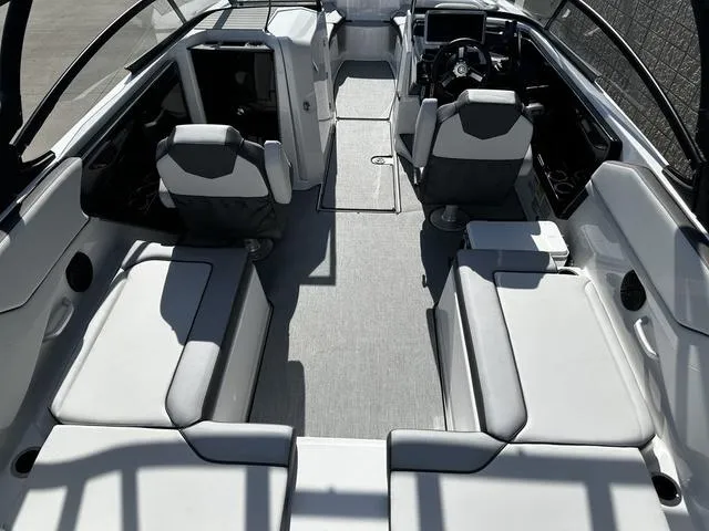 Slide: The Image of 2025 Yamaha Boats AR250 interior with sleek seating and modern dashboard design. - 8