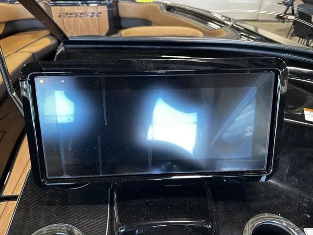 Slide: The Image of Touchscreen display on 2025 Yamaha Boats 255XD dashboard, featuring sleek black design. - 11