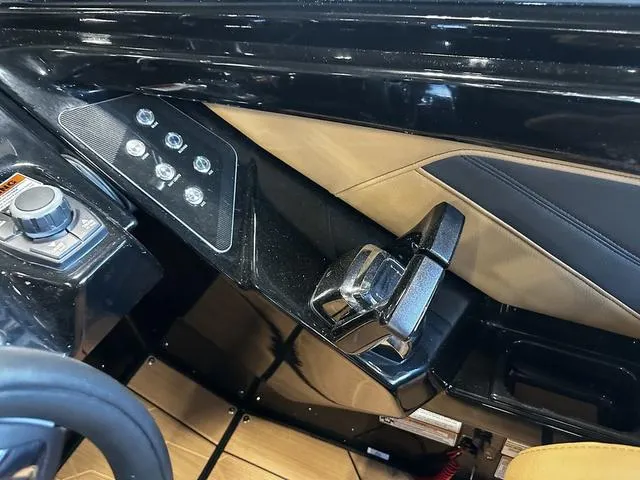 Slide: The Image of 2025 Yamaha Boats 255XD interior dashboard with modern controls and sleek design. - 13