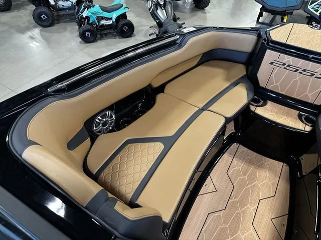 Slide: The Image of 2025 Yamaha Boats 255XD interior with tan seating and modern design elements. - 17