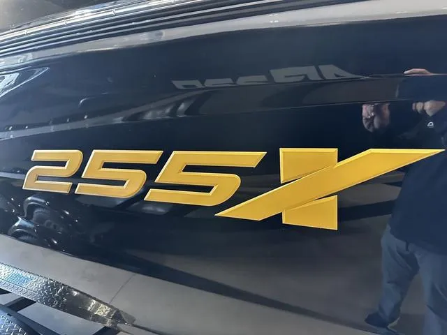 Slide: The Image of 2025 Yamaha Boats 255XD logo in bold yellow on sleek black surface. - 5