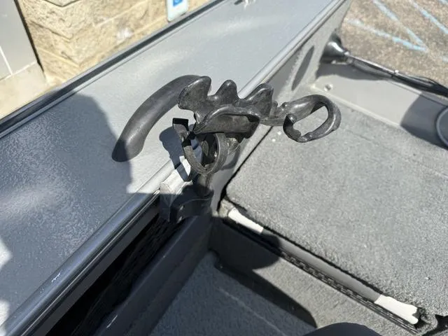 Slide: The Image of Boat interior with rod holder, 2012 Lund 1750 Tyee model, gray textured surface. - 26