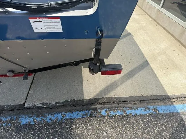 Slide: The Image of Rear view of a 2012 Lund 1750 Tyee boat on a trailer, parked on concrete. - 4