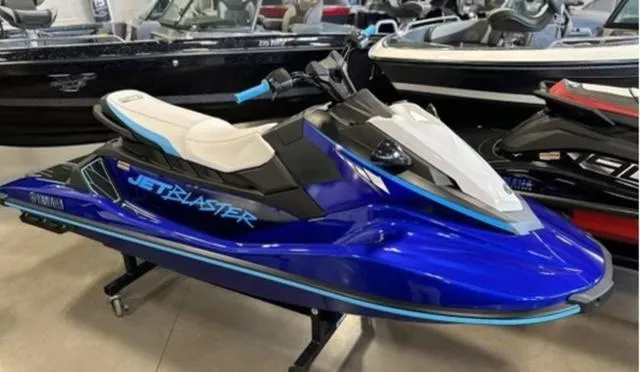Slide: The Image of 2024 Yamaha Waverunners Jetblaster in blue, displayed indoors on a stand. - 3