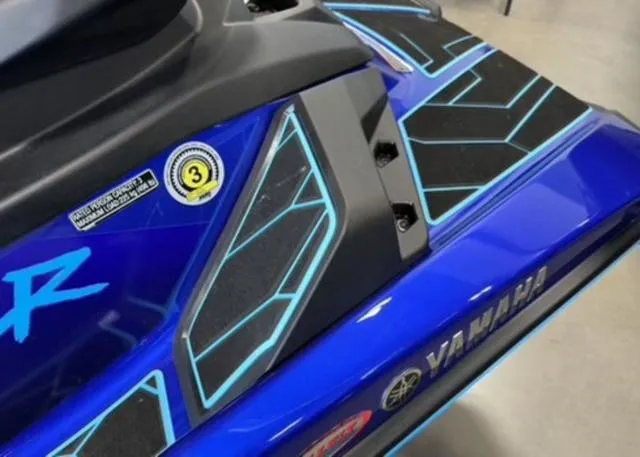 Slide: The Image of 2024 Yamaha Waverunner Jetblaster, blue with geometric patterns, close-up view. - 5