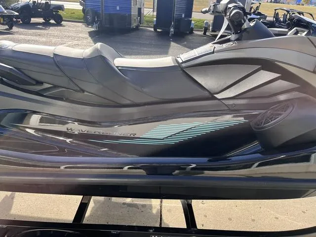 Slide: The Image of 2025 Yamaha Waverunner GP SVHO™ with Audio, sleek design, parked outdoors. - 24