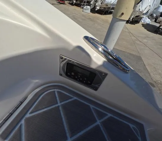 Slide: The Image of 2019 Chaparral 191 Suncoast boat interior with control panel and deck details. - 11