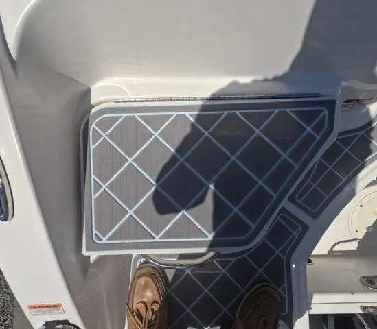 Slide: The Image of 2019 Chaparral 191 Suncoast boat deck with non-slip mat and shadow. - 13