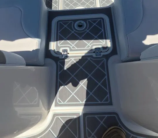 Slide: The Image of 2019 Chaparral 191 Suncoast boat interior with patterned flooring and seating. - 15