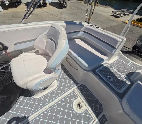 Slide: The Image of 2019 Chaparral 191 Suncoast boat interior with seating and deck details. - 19