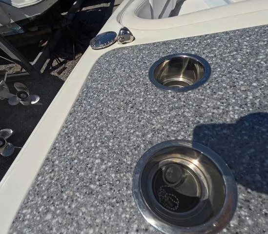 Slide: The Image of 2019 Chaparral 191 Suncoast boat with cup holders on a speckled surface. - 24