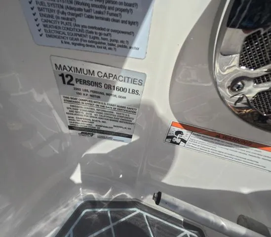 Slide: The Image of 2019 Chaparral 191 Suncoast capacity label, maximum 12 persons or 1600 lbs. - 26