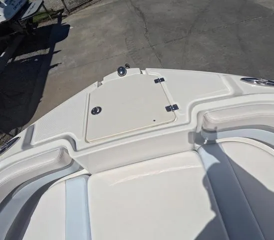 Slide: The Image of 2019 Chaparral 191 Suncoast boat bow with storage compartment and seating. - 36