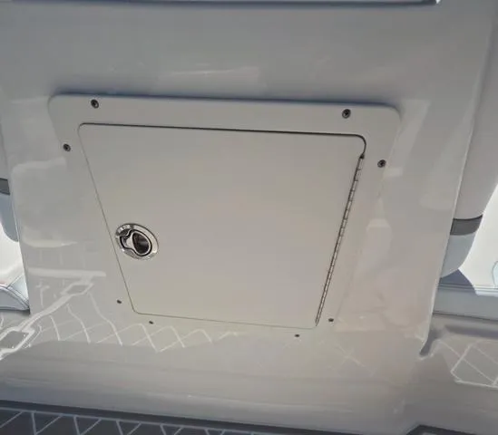 Slide: The Image of Access hatch on 2019 Chaparral 191 Suncoast boat, featuring sleek white design. - 41
