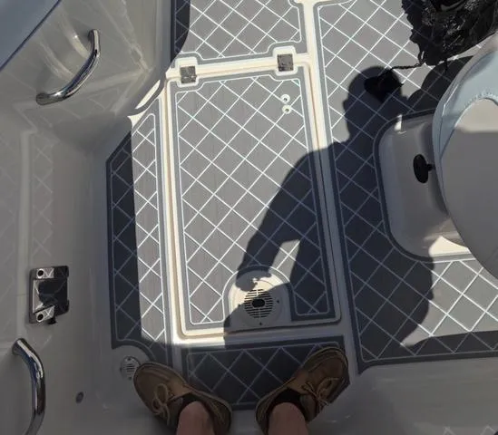 Slide: The Image of 2019 Chaparral 191 Suncoast boat deck with patterned flooring and seating area. - 43