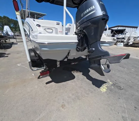 Slide: The Image of 2019 Chaparral 191 Suncoast boat with Yamaha outboard motor, parked on concrete. - 6