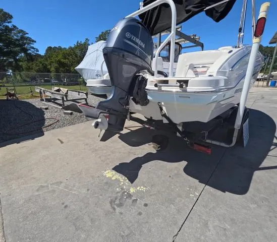 Slide: The Image of 2019 Chaparral 191 Suncoast boat with Yamaha outboard motor on trailer. - 8