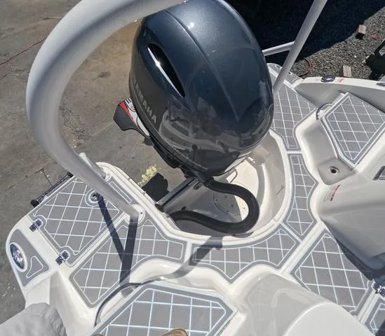 Slide: The Image of 2019 Chaparral 191 Suncoast boat with Yamaha outboard motor and patterned deck. - 9