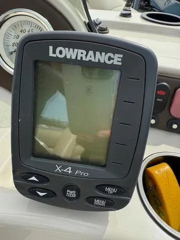 Slide: The Image of Lowrance X-4 Pro fishfinder on a 2012 Lowe SS250 boat dashboard. - 14
