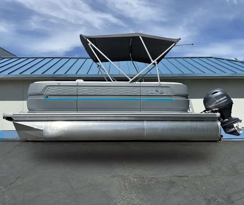 The Image of 2025 Aura Quad Lounge pontoon boat with canopy and Yamaha outboard motor. - 0