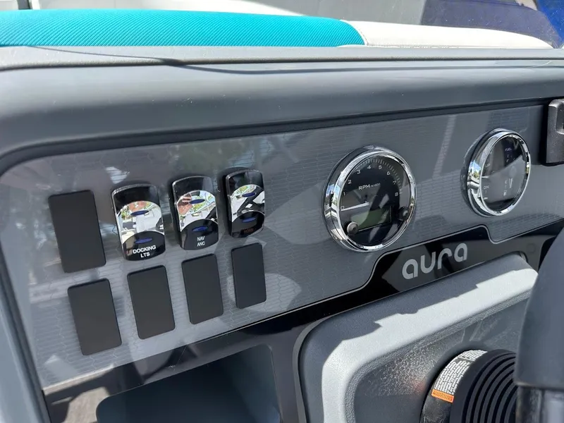 Slide: The Image of Dashboard of 2025 Aura Quad Lounge with gauges and controls. - 18