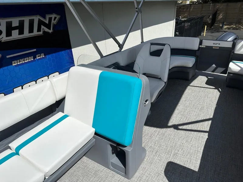 Slide: The Image of 2025 Aura Quad Lounge boat interior with gray and teal seating, spacious layout. - 7