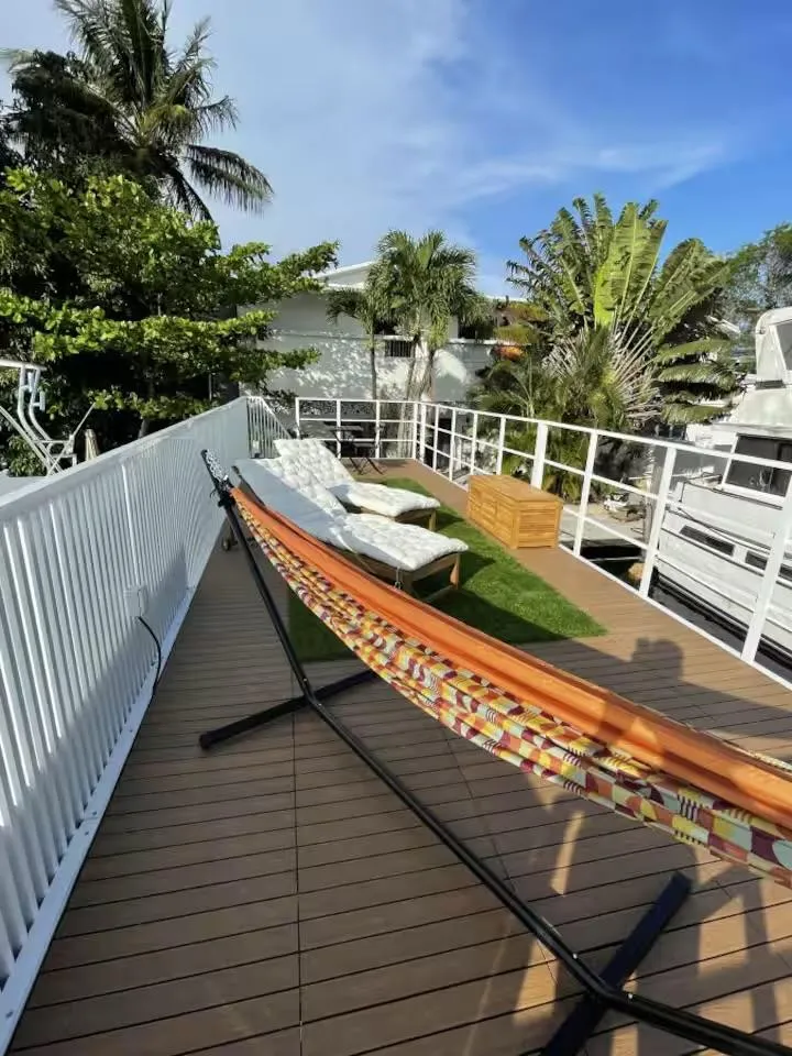 Slide: The Image of Rooftop deck with hammock, lounge chairs, and lush greenery, Modern Struktures MS 360, 2023. - 5