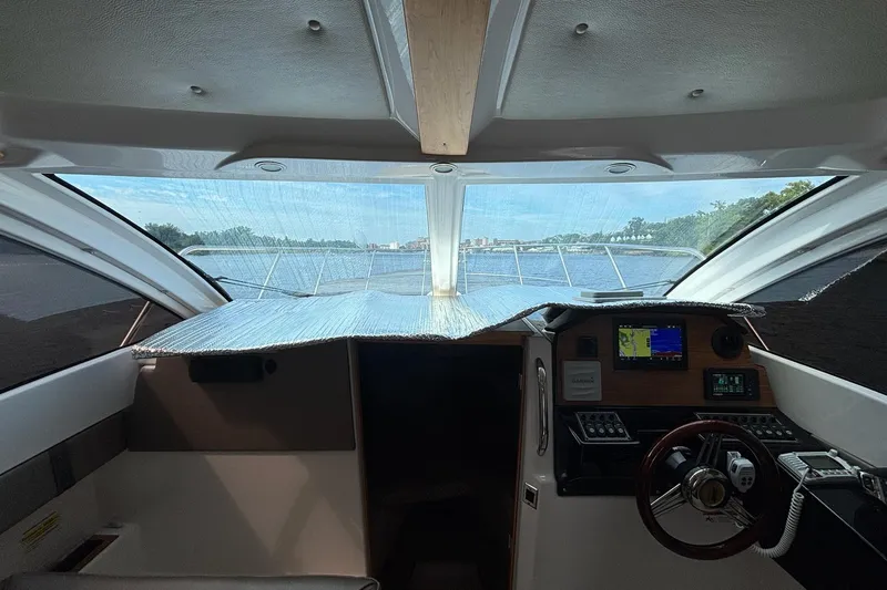 Slide: The Image of Interior view of 2022 Cutwater C-248 Coupe boat cockpit with navigation equipment. - 13